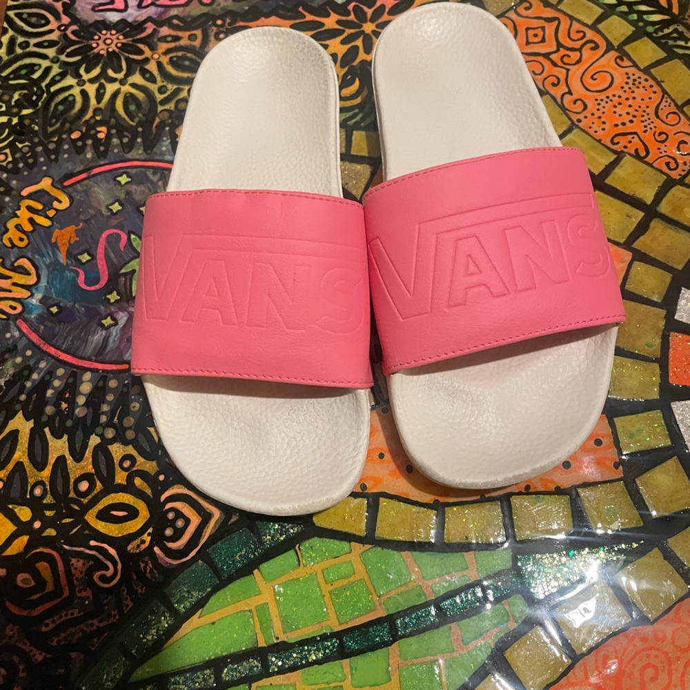 Vans pink slides.